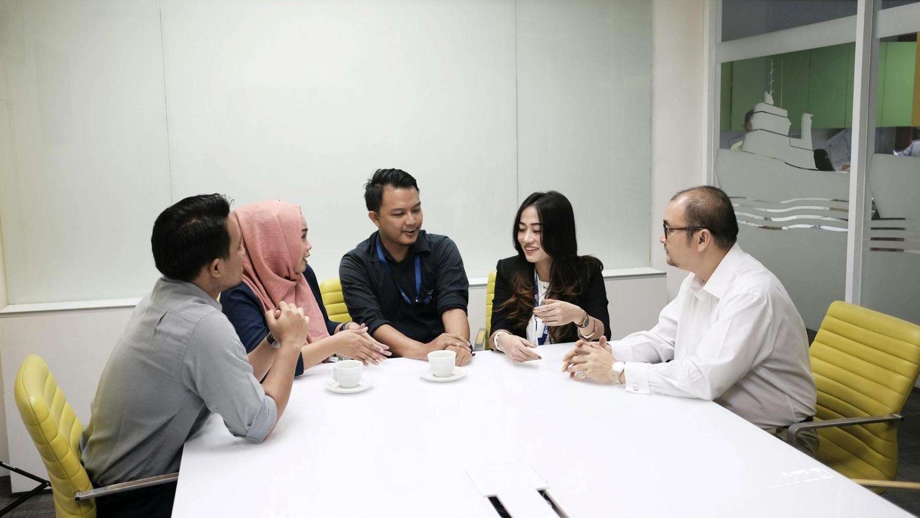 Professional finance team reviewing budget compliance documents